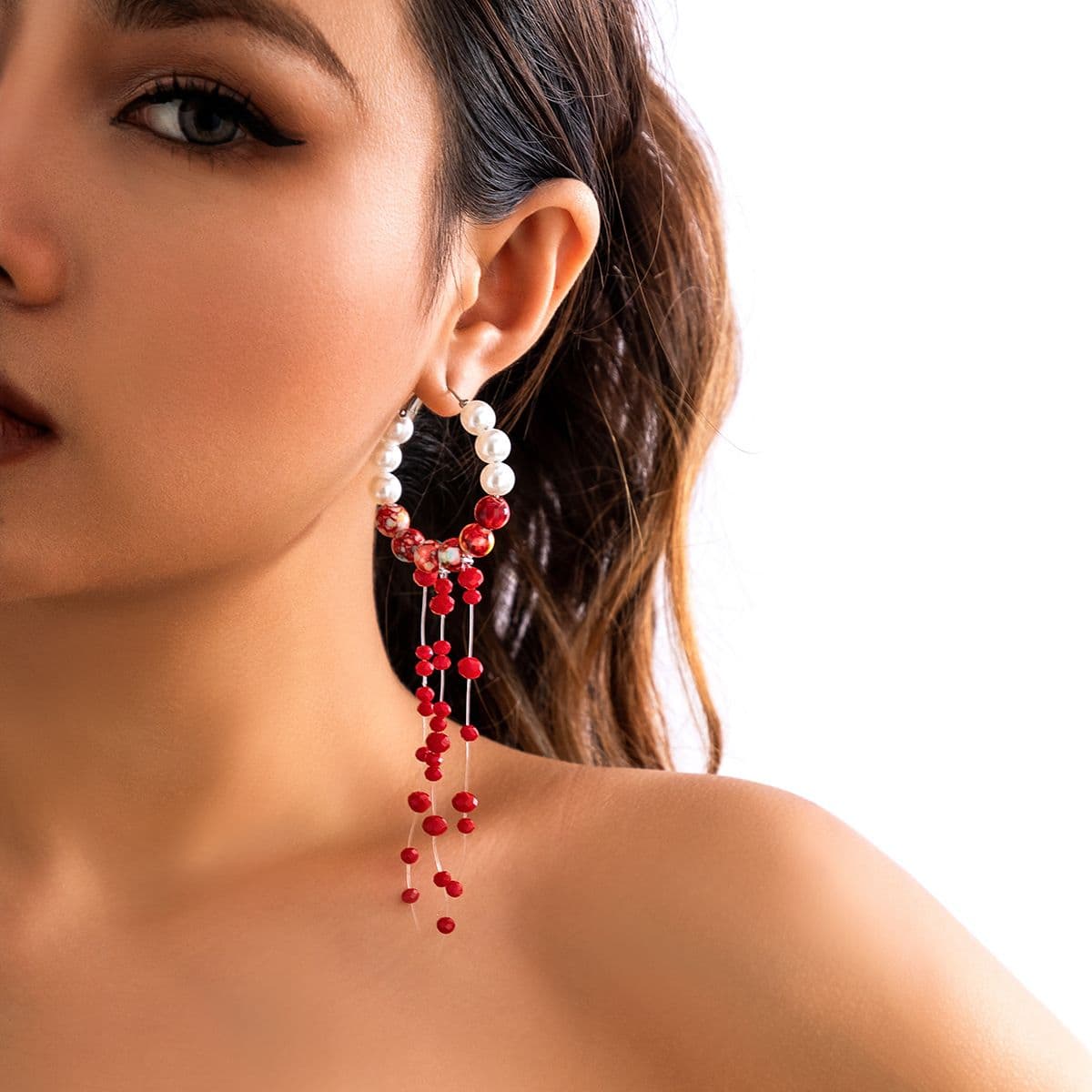 13 White K Earrings